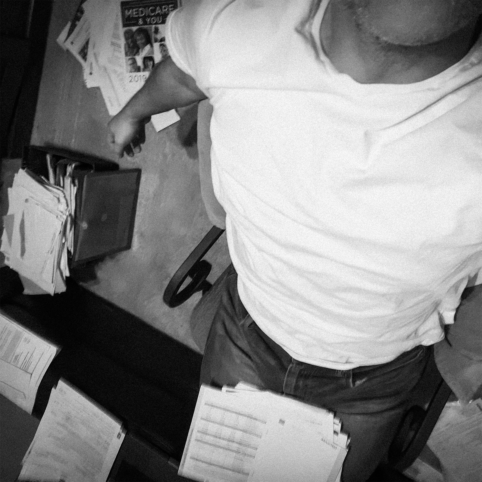 The author at 2am with a stack of mail and a cardboard box of estate documents